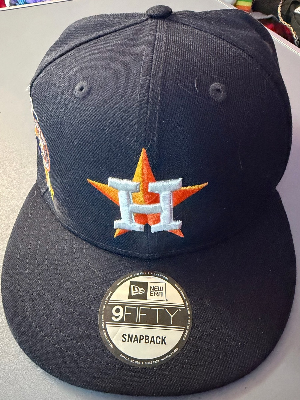 New Era Navy Snapback Hat with Orange & White Houston Star Logo